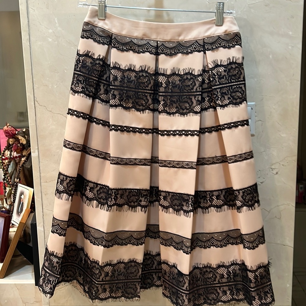 Light pink with black skirt